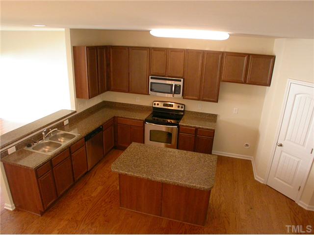 4607 Pat Reed Road Raleigh, NC 27616 - Photo 5 of 20 Open kitchen with spacious isalnd and walk-in pantry.