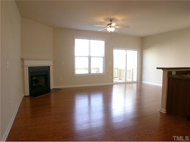 4607 Pat Reed Road Raleigh, NC 27616 - Photo 10 of 20 Beautiful harwoods in bright living room that leads out large deck.