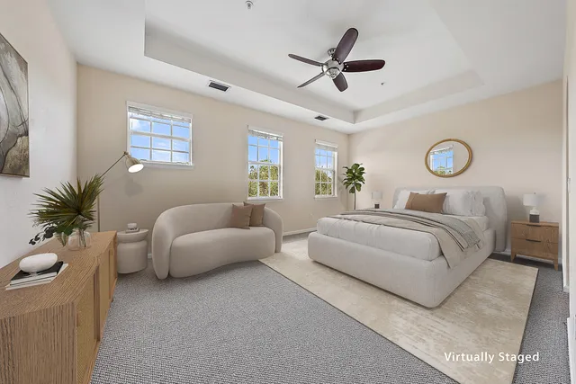 a bedroom with bed and a chandelier