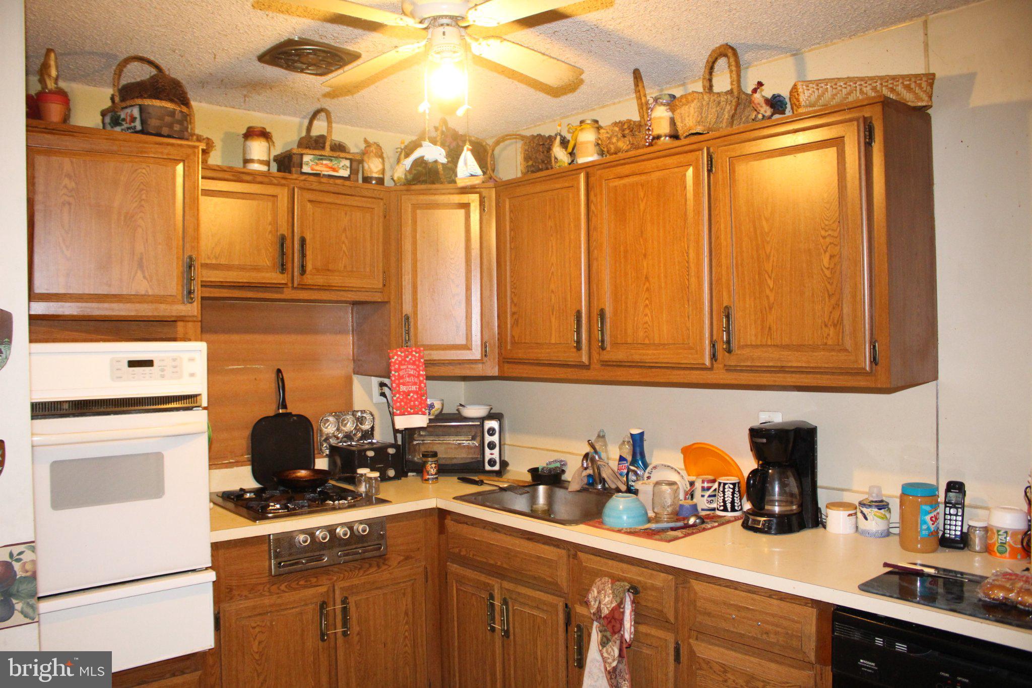 222 Ogden Sta Road Deptford, NJ 08090 - Photo 25 of 37 Cozy kitchen with warm wooden tones.
