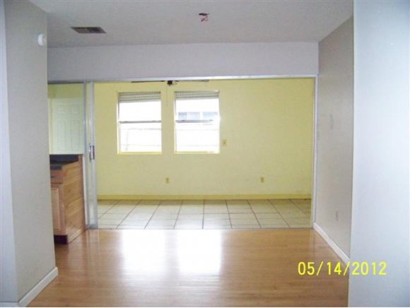 2959 Northeast Gemini Palm Bay, FL 32905 - Photo 3 of 12 a view of an empty room with a window