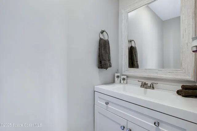 a kitchen with a table chairs refrigerator and microwave