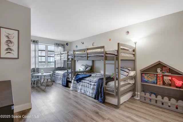 a hotel room with a television and a walk in closet