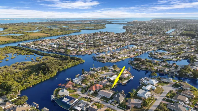 a view of house with swimming pool lawn chairs and a yard