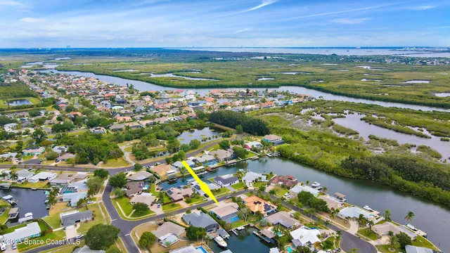 a bedroom with two beds and windows