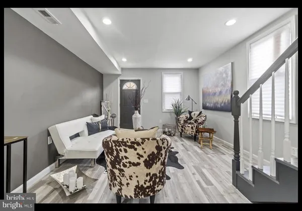 a living room with furniture and a table