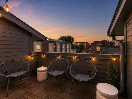 a backyard of a house with table and chairs