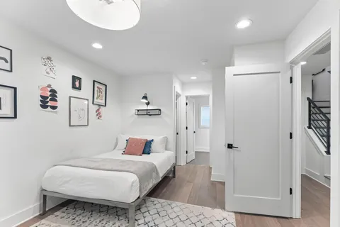 a bedroom with a bed and a table