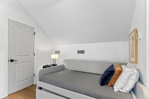 a living room with furniture and a bed