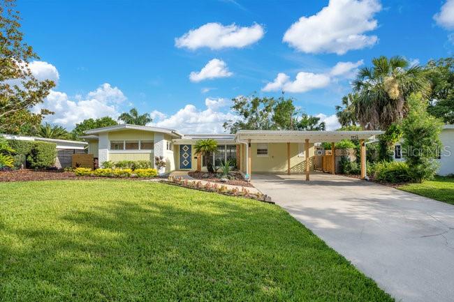 1926 Natalen Road Winter Park, FL 32792 - Photo 1 of 44 a front view of a house with swimming pool having outdoor seating