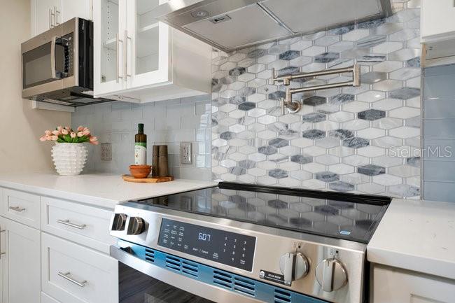 1926 Natalen Road Winter Park, FL 32792 - Photo 15 of 44 a kitchen with a stove and a microwave