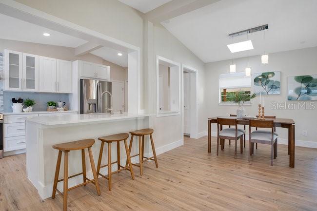 1926 Natalen Road Winter Park, FL 32792 - Photo 19 of 44 a dining room with furniture and wooden floor