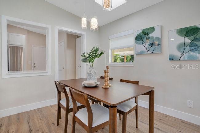 1926 Natalen Road Winter Park, FL 32792 - Photo 20 of 44 a view of a dining room with furniture and wooden floor