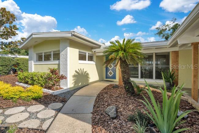 1926 Natalen Road Winter Park, FL 32792 - Photo 2 of 44 a front view of house with yard outdoor seating and barbeque oven