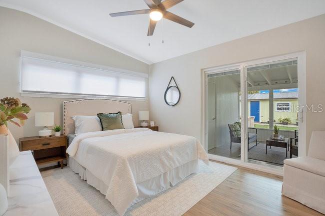 1926 Natalen Road Winter Park, FL 32792 - Photo 22 of 44 a bedroom with a bed and a chandelier