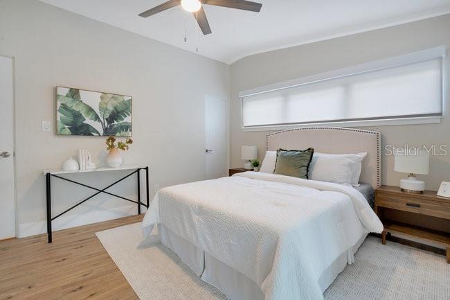 1926 Natalen Road Winter Park, FL 32792 - Photo 23 of 44 a bedroom with a bed a desk and chair