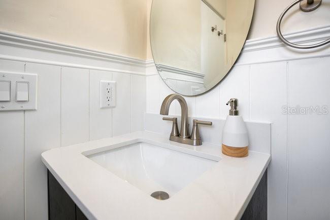 1926 Natalen Road Winter Park, FL 32792 - Photo 26 of 44 a bathroom with a sink and a mirror
