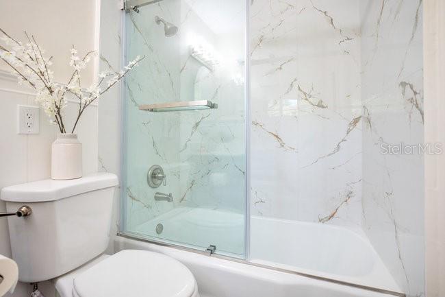 1926 Natalen Road Winter Park, FL 32792 - Photo 27 of 44 a bathroom with a toilet and a bathtub