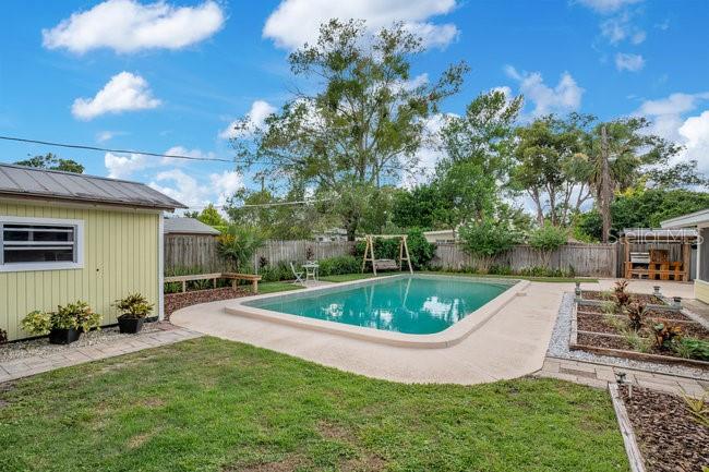 1926 Natalen Road Winter Park, FL 32792 - Photo 35 of 44 a view of a swimming pool with a patio