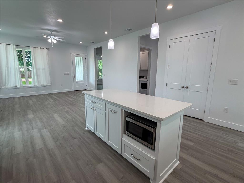 4200 Williams Road Bellmead, TX 76705 - Photo 10 of 22 a kitchen with a stove and a wooden floor