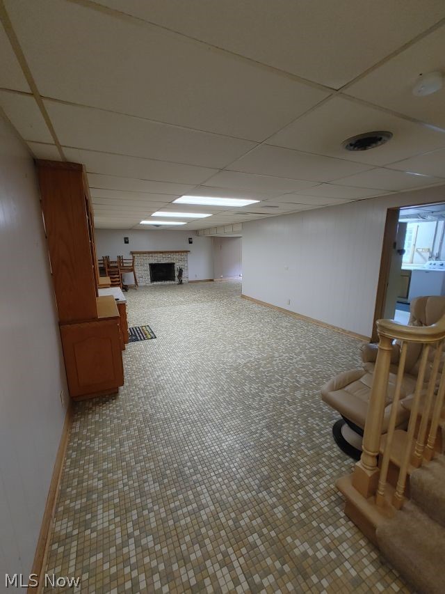 2211 Devonshire Road Northwest Canton, OH 44708 - Photo 28 of 36 Basement with tile floors, a fireplace, and a drop ceiling