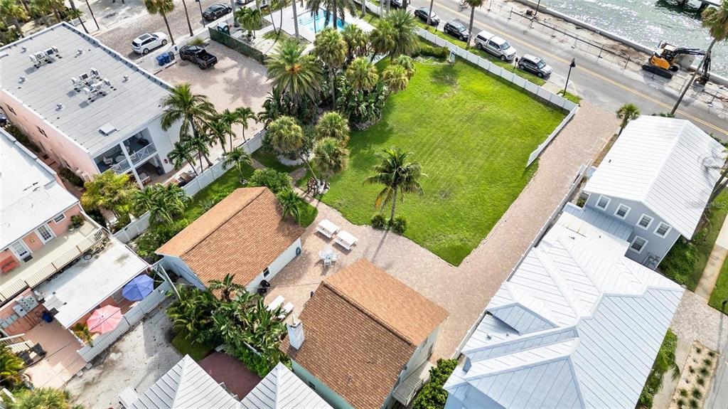 702 Pass A Grille Way St. Pete Beach, FL 33706 - Photo 6 of 41 an aerial view of a house with a garden and swimming pool