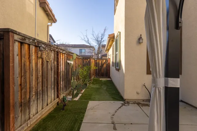 a front view of a house with a street