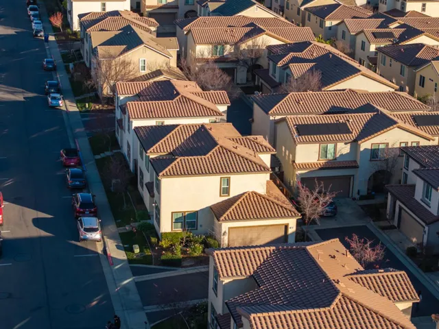 an aerial view of a house with a ocean view