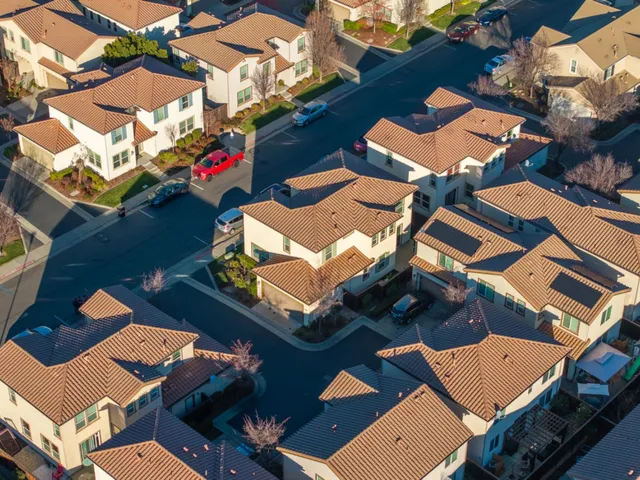 a roof deck with table and chairs
