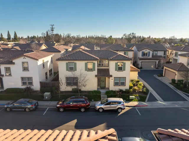 an aerial view of multiple houses with outdoor space