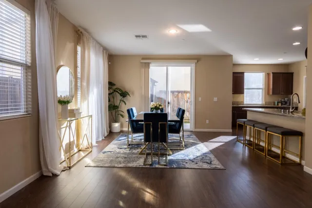 a living room with furniture or couch and a potted plant