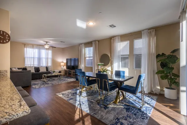 a living room with furniture window and wooden floor