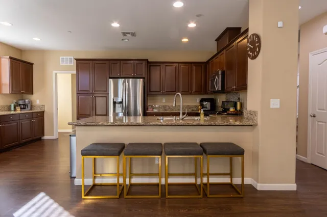 a kitchen with a refrigerator sink and microwave