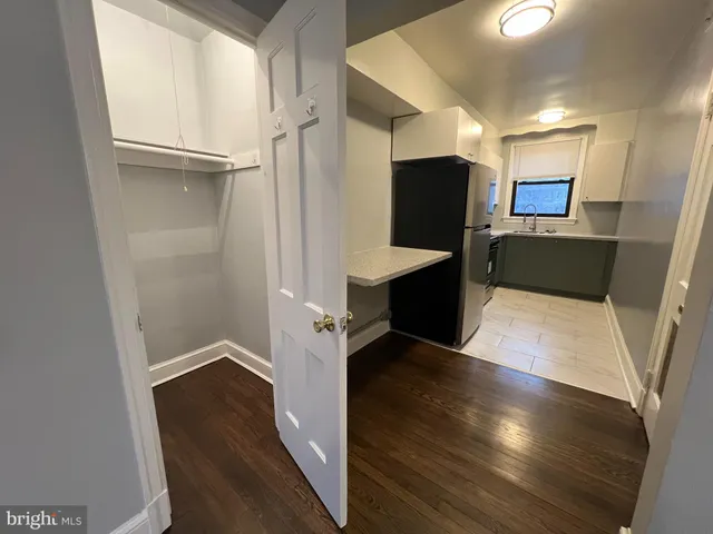 a view of a living room with wooden floor
