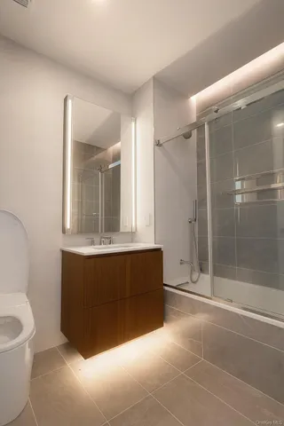 a spacious bathroom with a bathtub and a shower