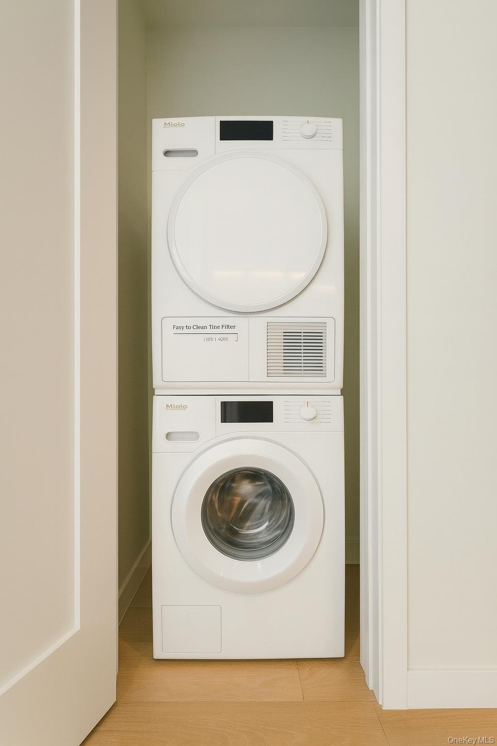 35-32 Leavitt Street, Unit PHK Queens, NY 11354 - Photo 7 of 10 a utility room with dryer and washer