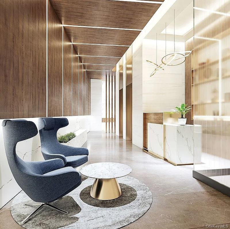 35-32 Leavitt Street, Unit PHK Queens, NY 11354 - Photo 9 of 10 a living room with furniture and a chandelier