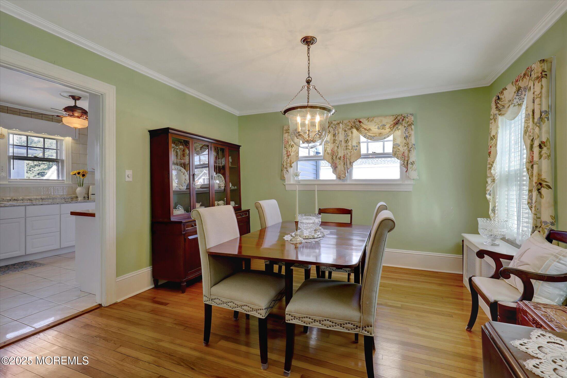 309 Spier Avenue Allenhurst, NJ 07711 - Photo 11 of 32 a view of a dining room with furniture window and wooden floor