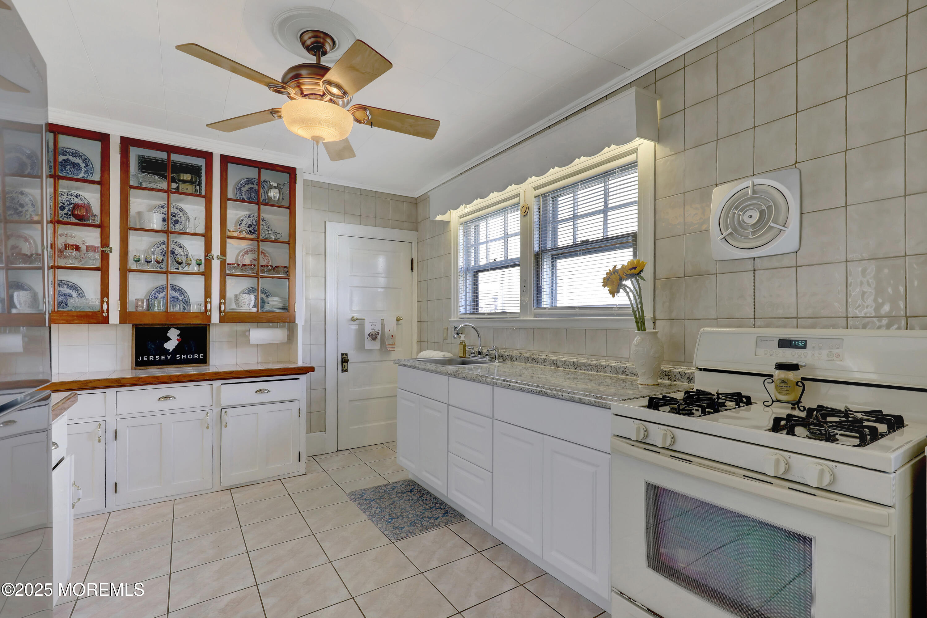 309 Spier Avenue Allenhurst, NJ 07711 - Photo 12 of 32 a kitchen with a sink cabinets and window
