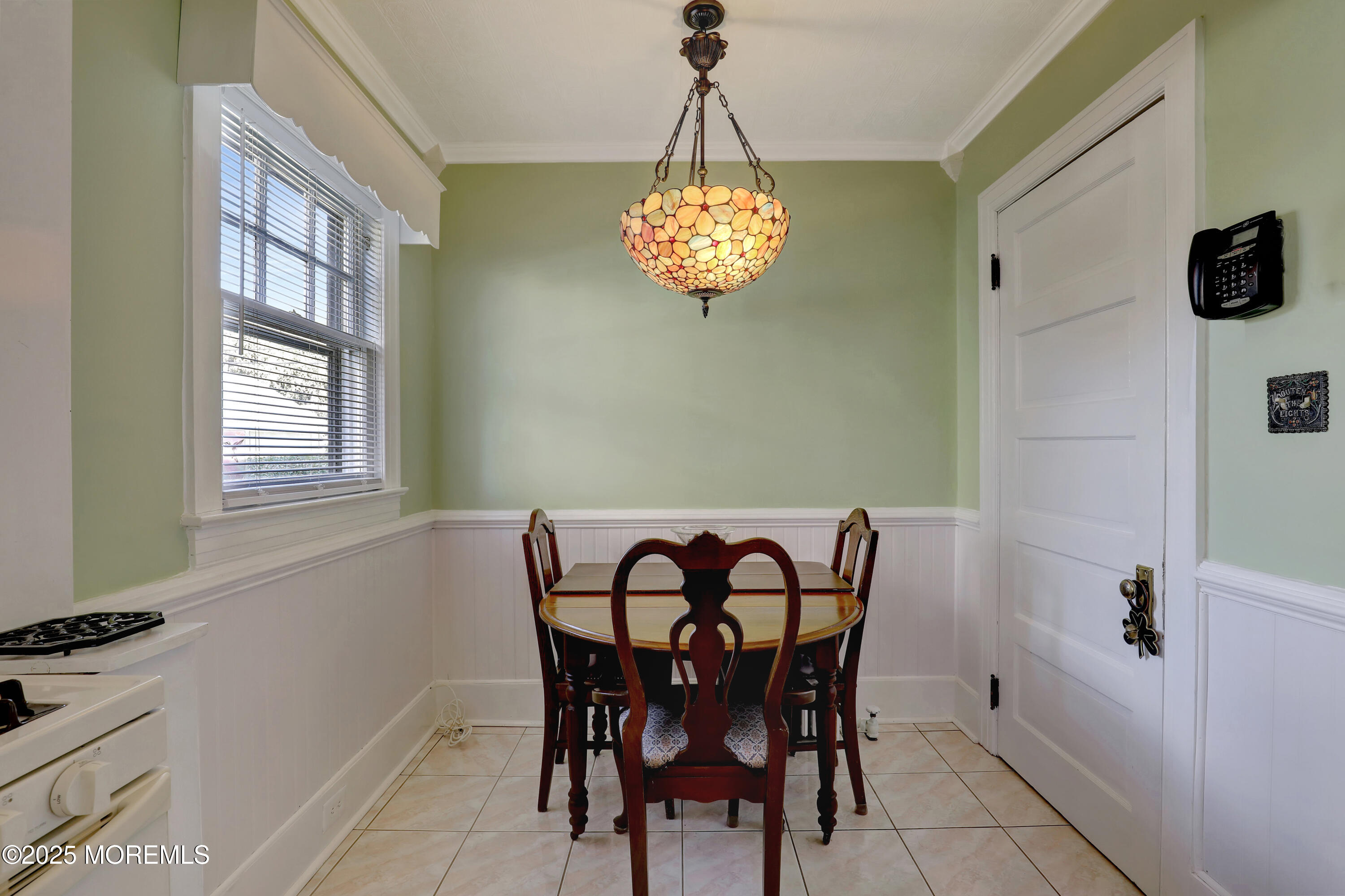 309 Spier Avenue Allenhurst, NJ 07711 - Photo 15 of 32 a view of a dining room with furniture and chandelier