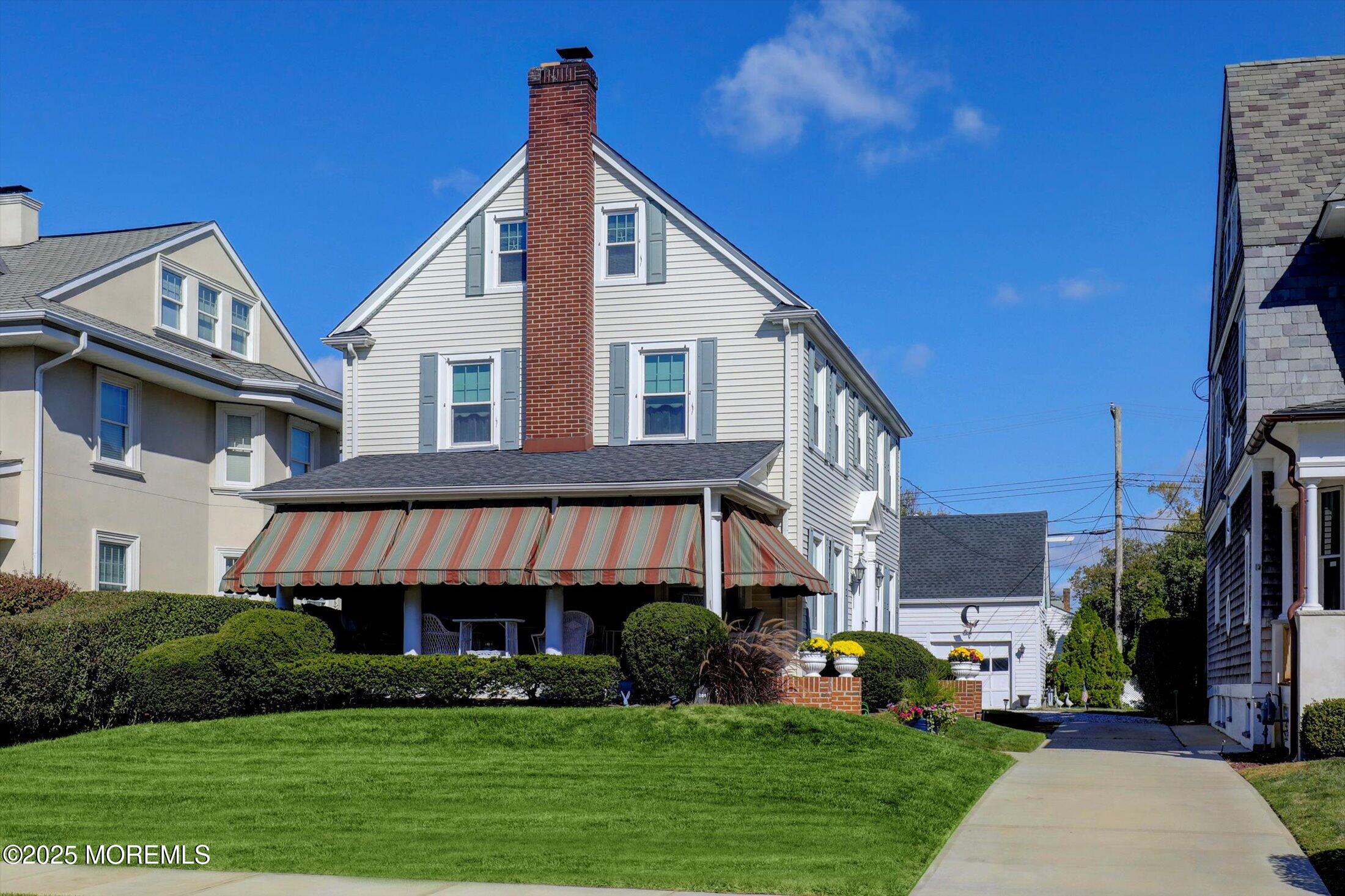 309 Spier Avenue Allenhurst, NJ 07711 - Photo 2 of 32 a front view of a house with a yard