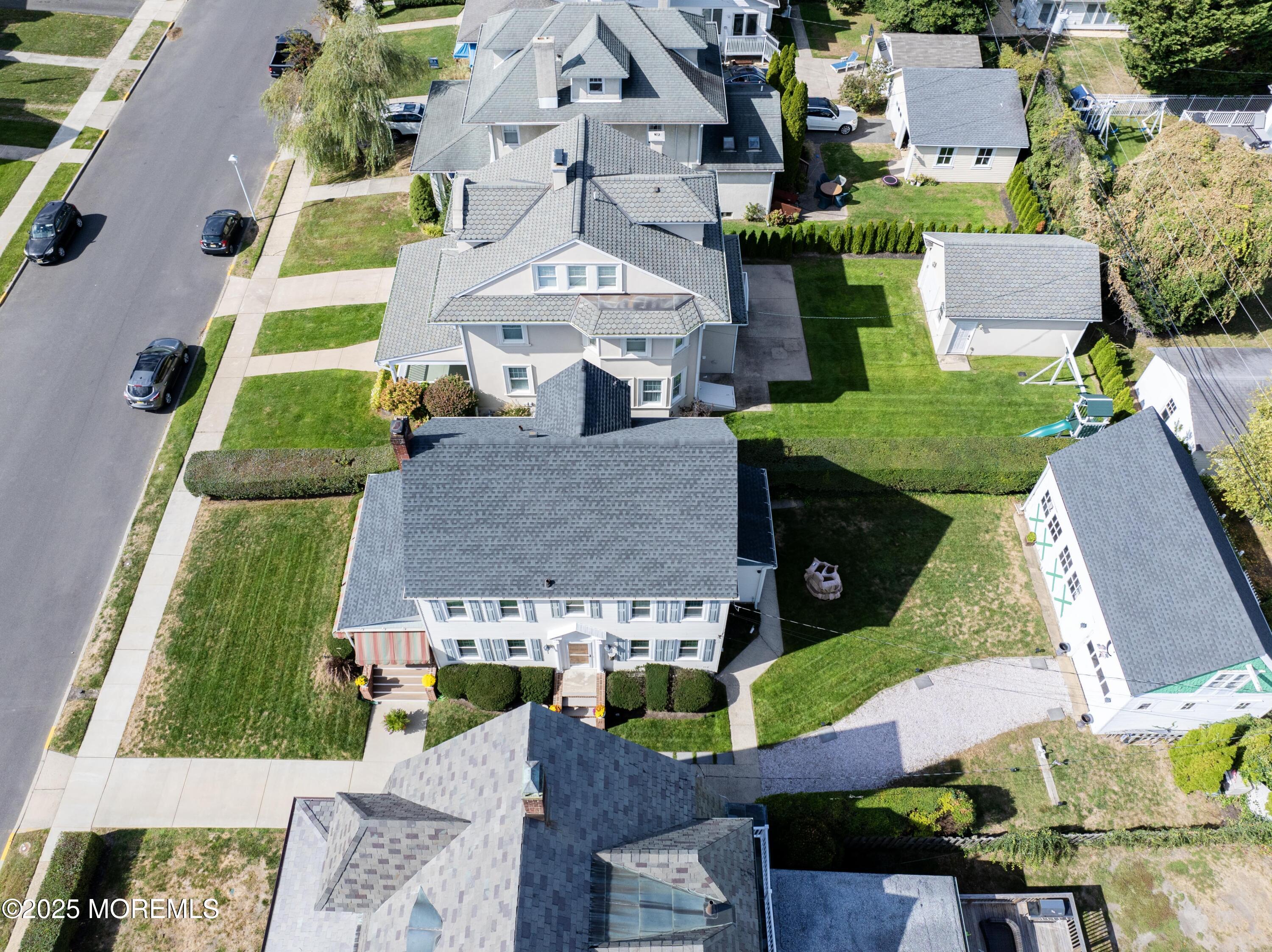 309 Spier Avenue Allenhurst, NJ 07711 - Photo 29 of 32 an aerial view of multiple houses with a yard