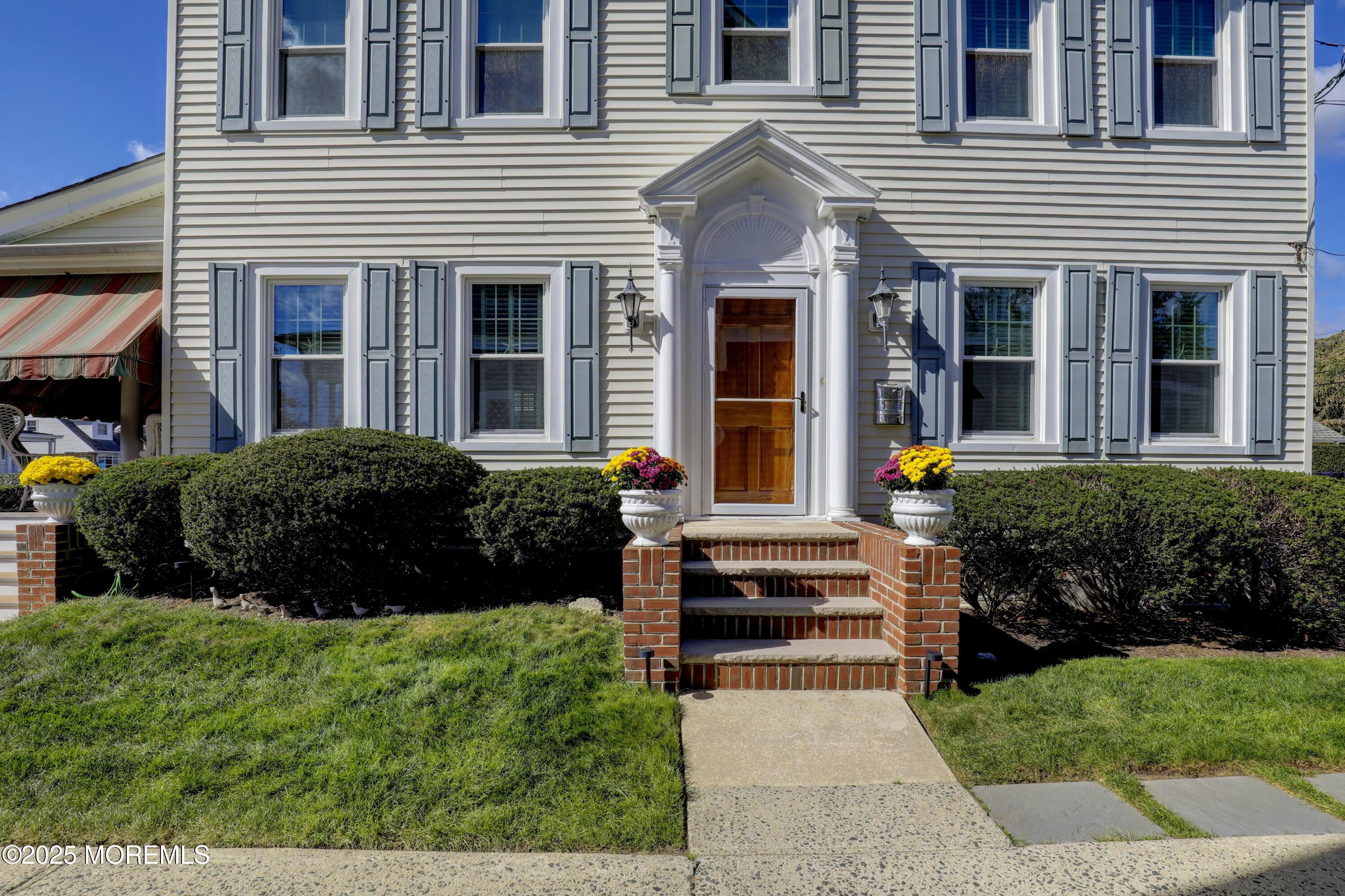 309 Spier Avenue Allenhurst, NJ 07711 - Photo 3 of 32 a view of a house with a garden and pathway
