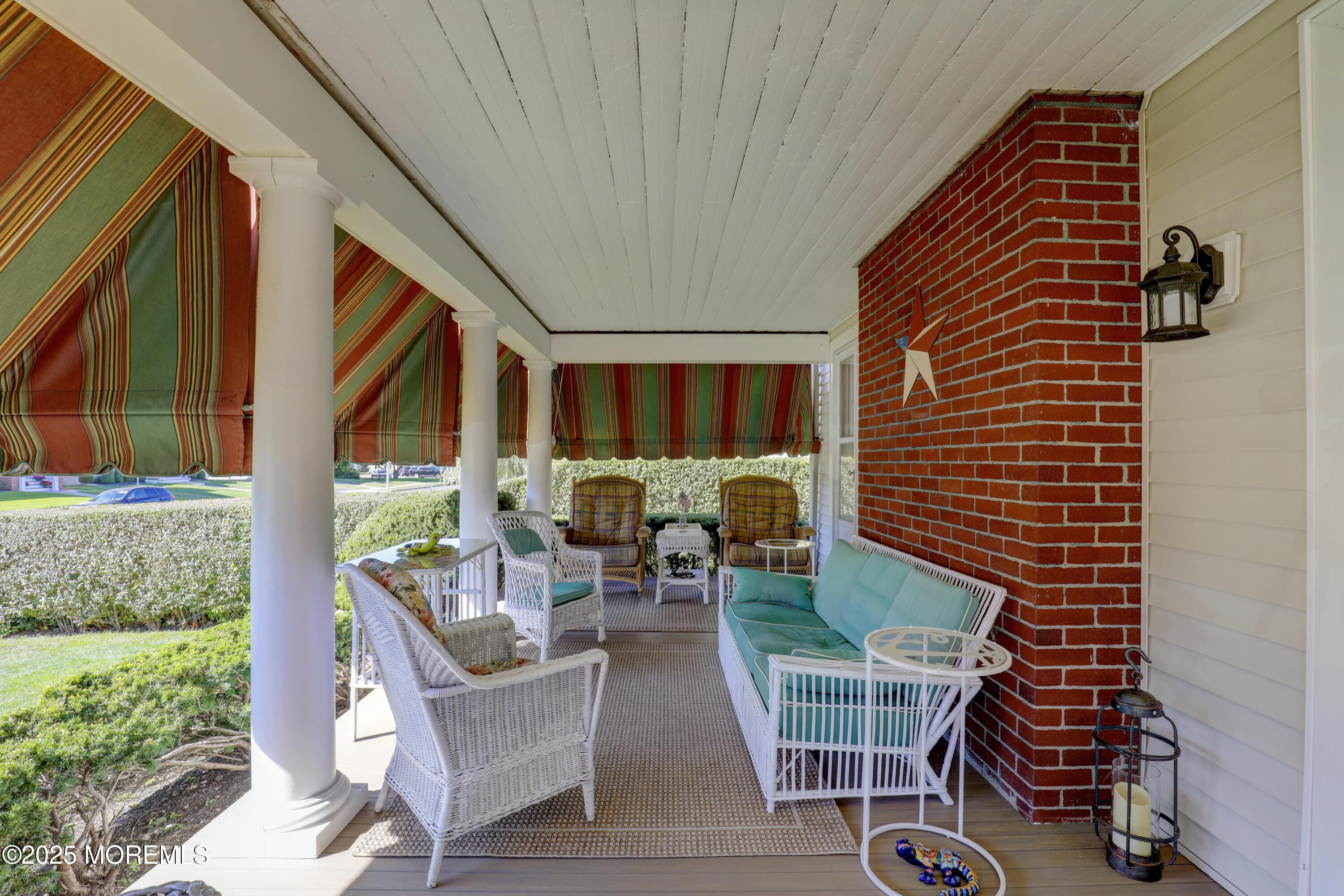 309 Spier Avenue Allenhurst, NJ 07711 - Photo 4 of 32 a balcony with chairs and a table