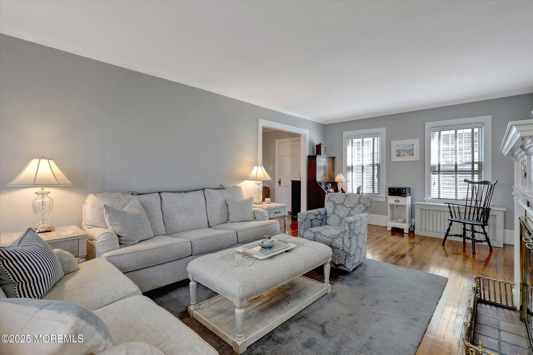 309 Spier Avenue Allenhurst, NJ 07711 - Photo 9 of 32 a living room with furniture potted plant and a lamp