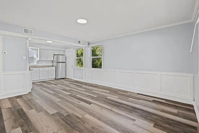 a view of a kitchen with a closet and a window
