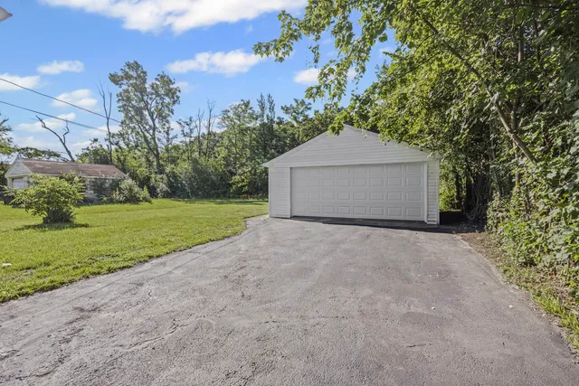 a picture of a bench in front of a gate