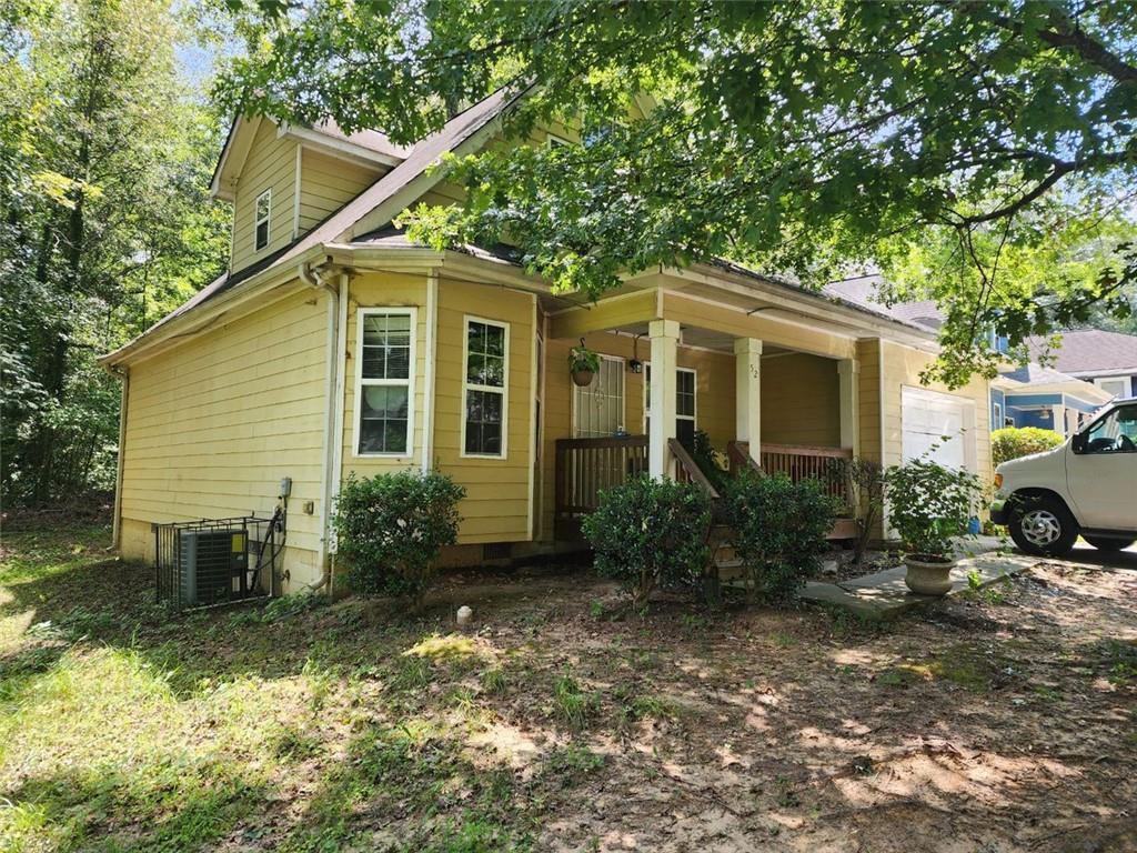 52 Johnson Road Northwest Atlanta, GA 30318 - Photo 1 of 1 a front view of a house with garden
