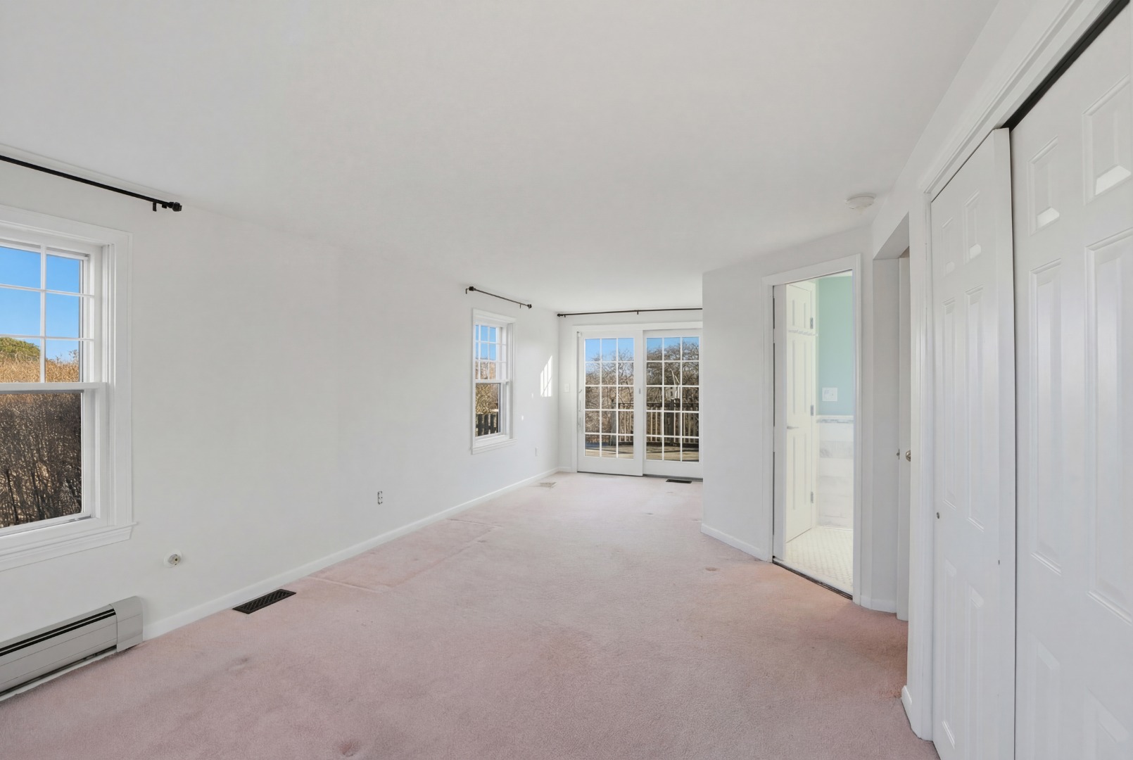 31 Flintlock Road Nantucket, MA 02554 - Photo 13 of 23 1st floor primary with sliders to the deck