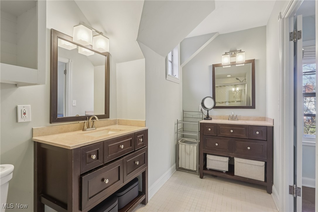 17024 Fernway Road Cleveland, OH 44120 - Photo 27 of 46 Primary Bathroom with two vanities and a shower